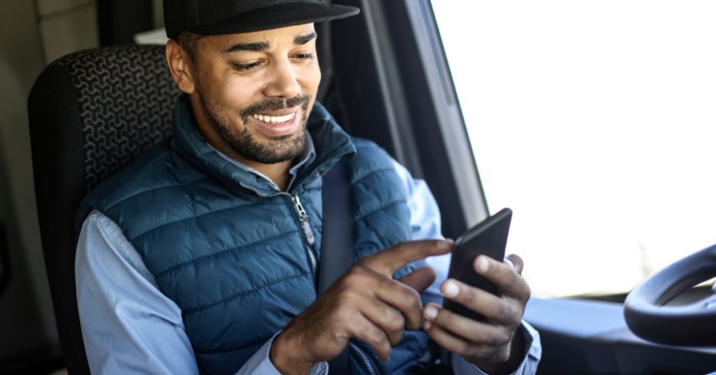 man scrolling phone